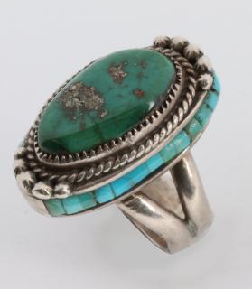 Appraisal: AN UNUSUAL LES BAKER WORKSHOP TURQUOISE NAVAJO RING Turquoise and