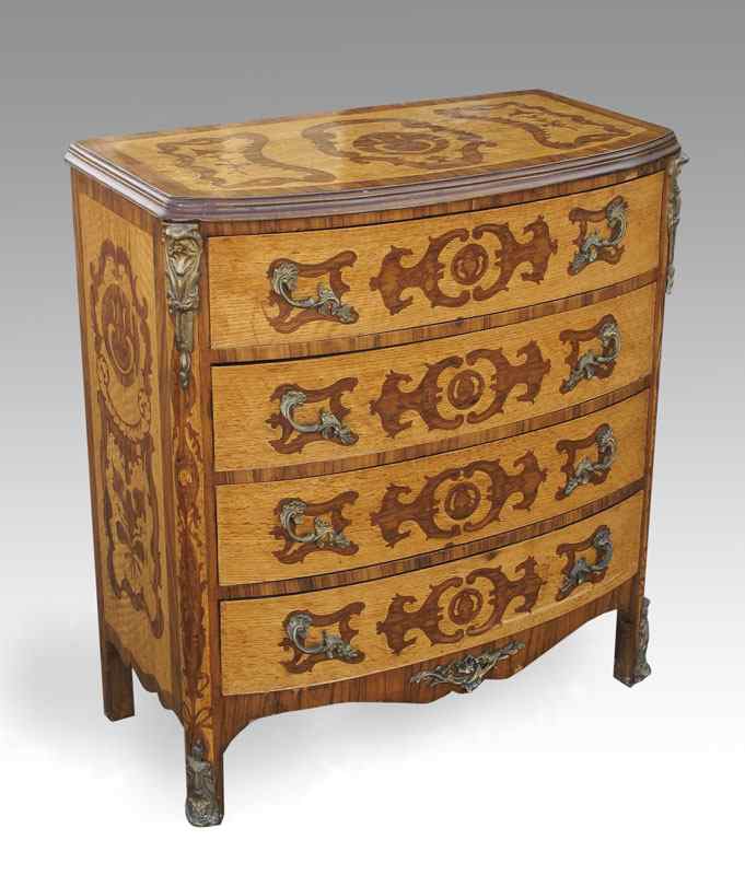 Appraisal: FRENCH STYLE DRAWER CHEST Ormolu mounted chest with stained inlay