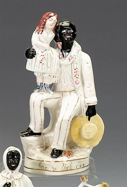 Appraisal: Staffordshire polychrome decorated figure of Uncle Tom and Eva second