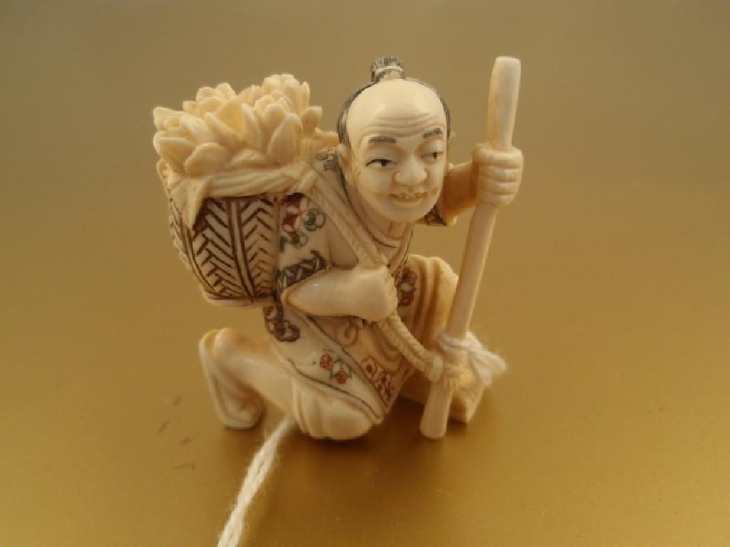 Appraisal: A thC Japanese ivory netsuke figure of a kneeling man