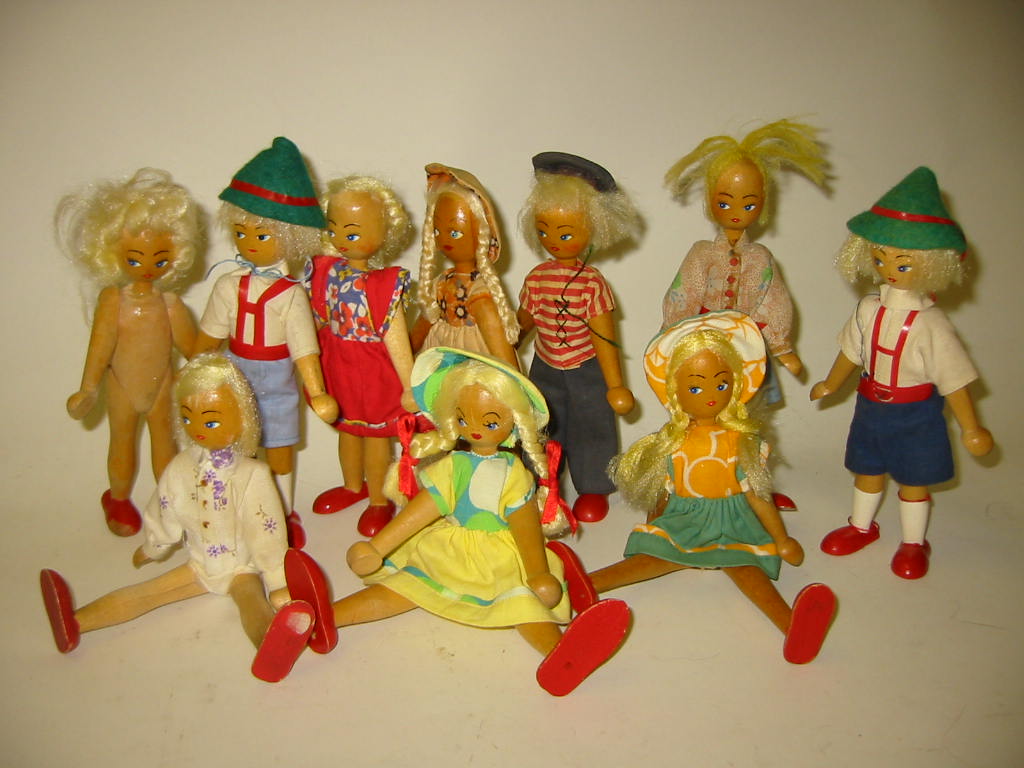 Appraisal: Ten Polish turned wood dolls c with painted faces swivel