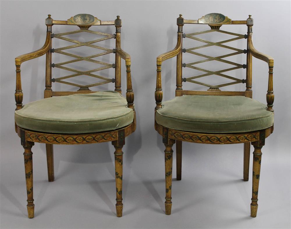 Appraisal: PAIR OF CLASSICAL PAINTED ARMCHAIRS having a carved crest rail