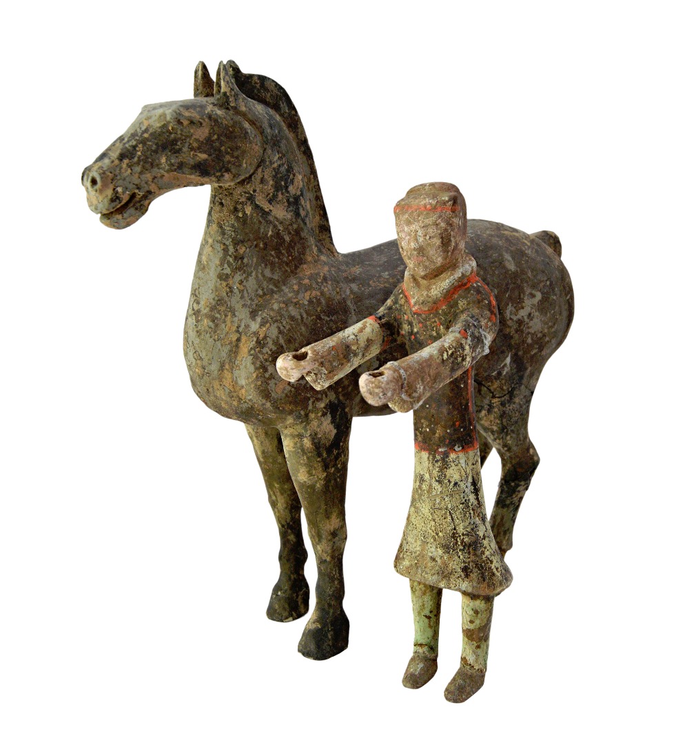 Appraisal: A Chinese pottery model of a horse and groom Han