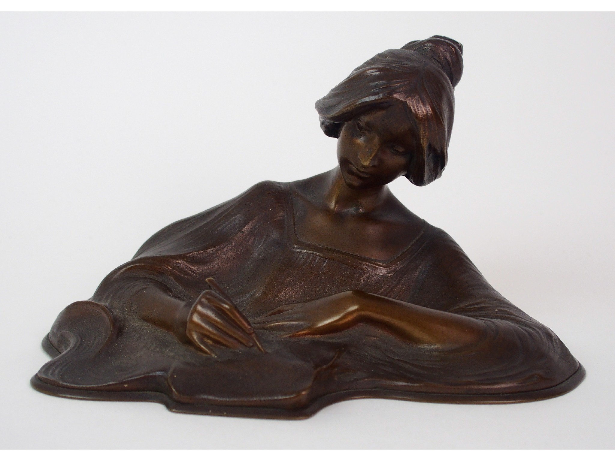 Appraisal: An Art Nouveau cast patinated spelter figure of a ladymodelled