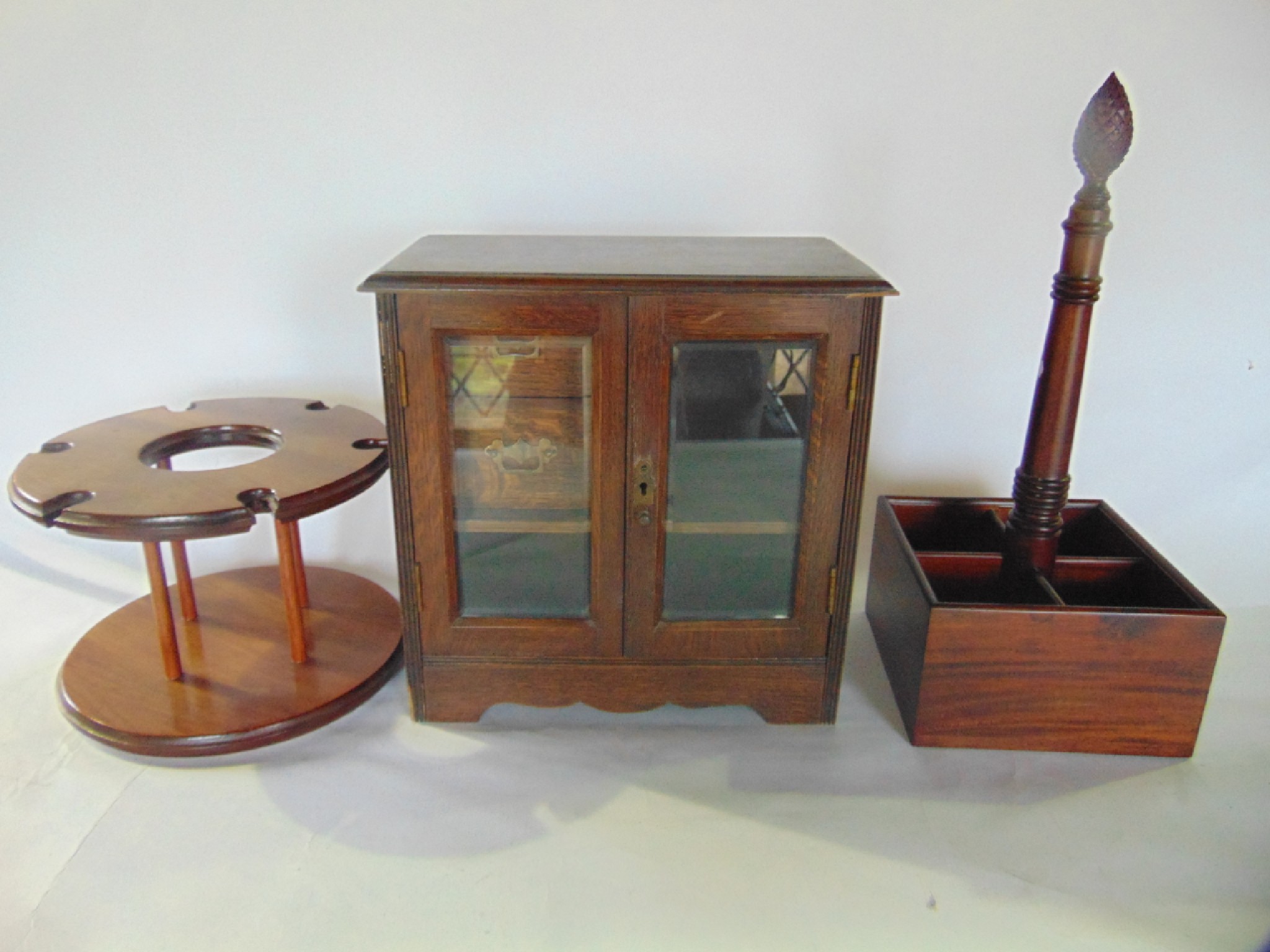 Appraisal: A th century oak smokers cabinet with bevelled glazed panelled