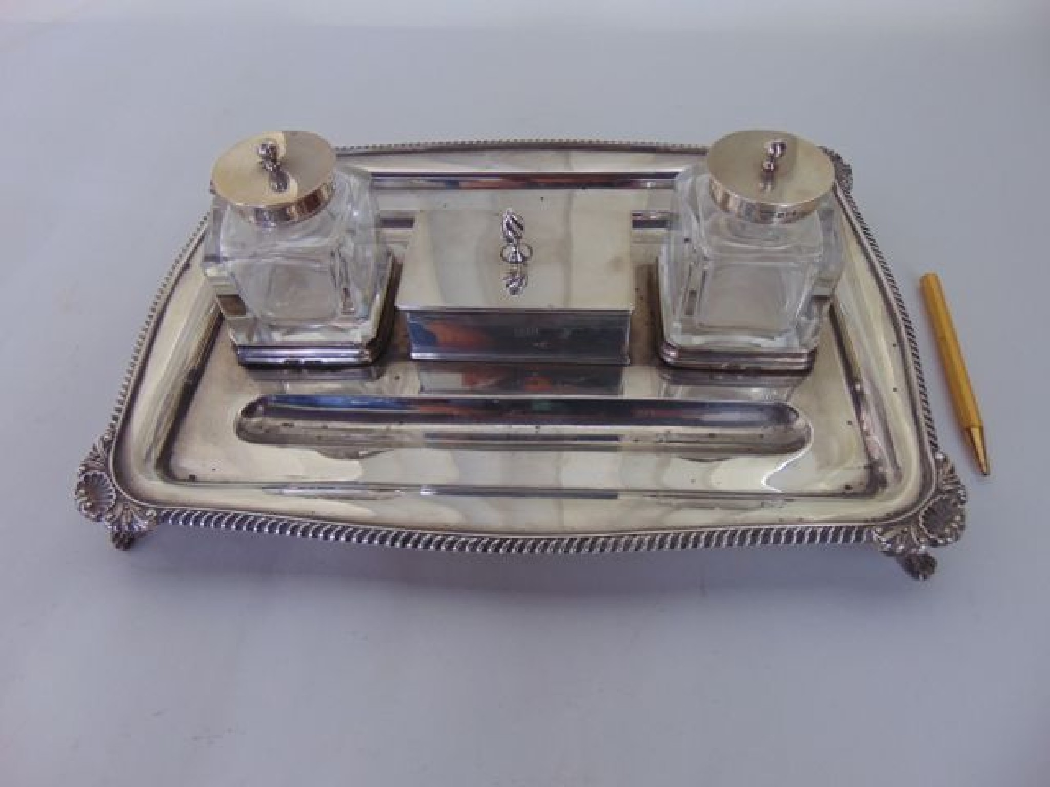 Appraisal: An Edwardian silver inkstand Goldsmiths Silversmiths Co Ltd London the