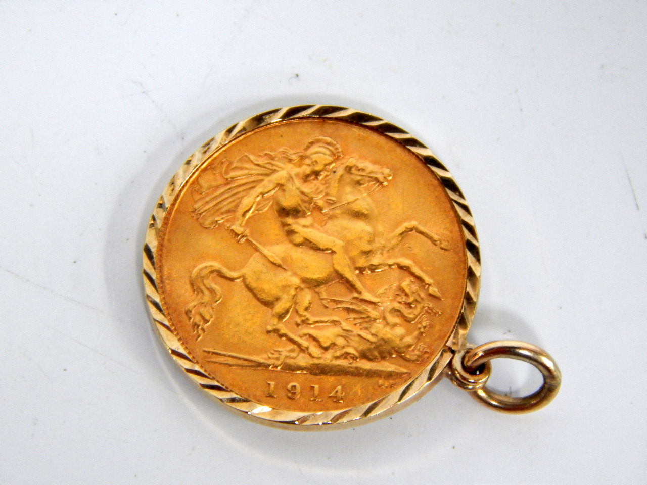 Appraisal: A George V half sovereign in a ct gold pendant