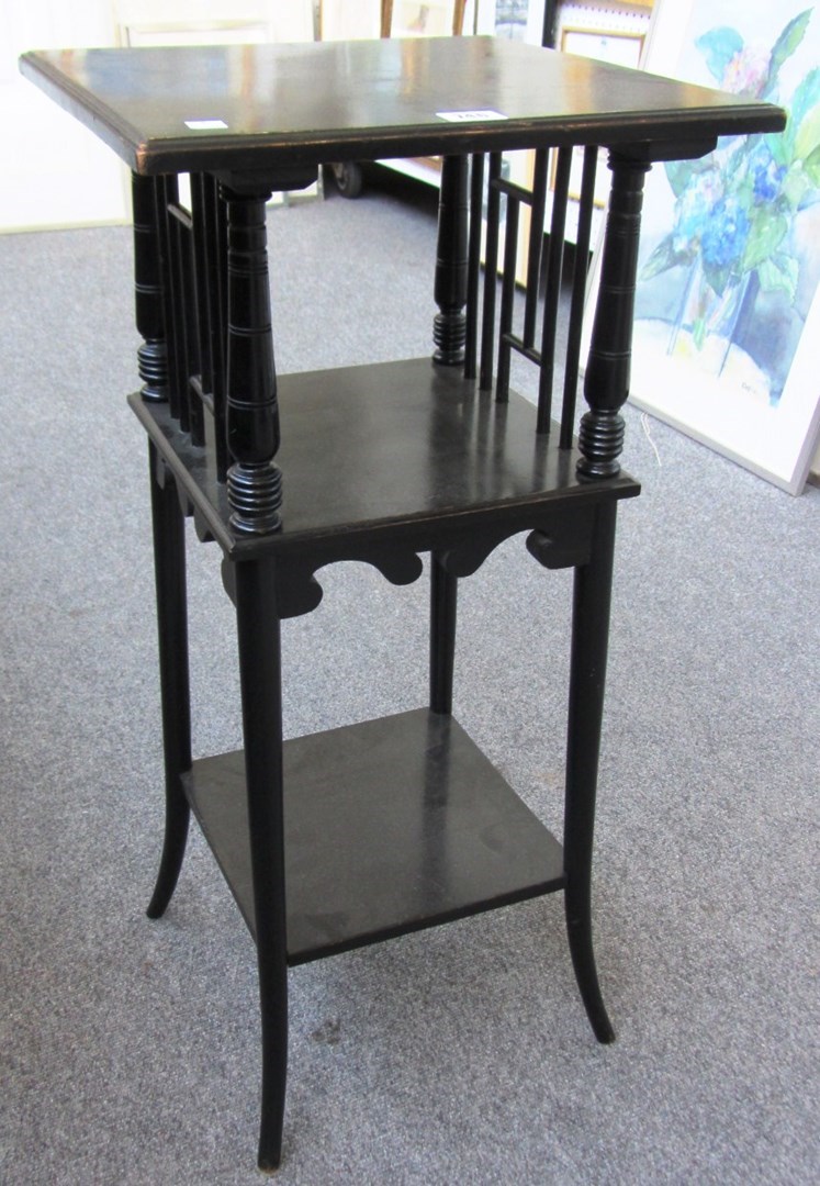 Appraisal: In the manner of Godwin an ebonised square three tier