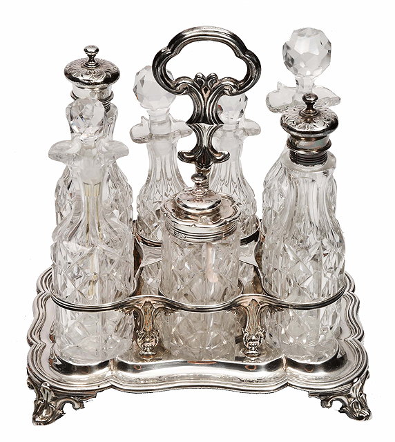 Appraisal: A VICTORIAN SILVER AND CUT GLASS CRUET SET fitted with