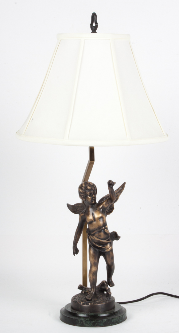 Appraisal: Bronze figural lamp bronze putti figure mounted on marbleized base