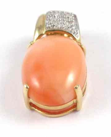 Appraisal: CORAL DIAMOND AND FOURTEEN KARAT GOLD PENDANT with four round-cut