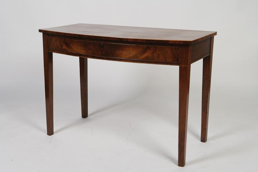 Appraisal: A GEORGE III MAHOGANY BOW FRONT SIDE TABLE the bow