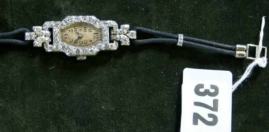 Appraisal: An Art Deco diamond wristwatch with small silvered dial with