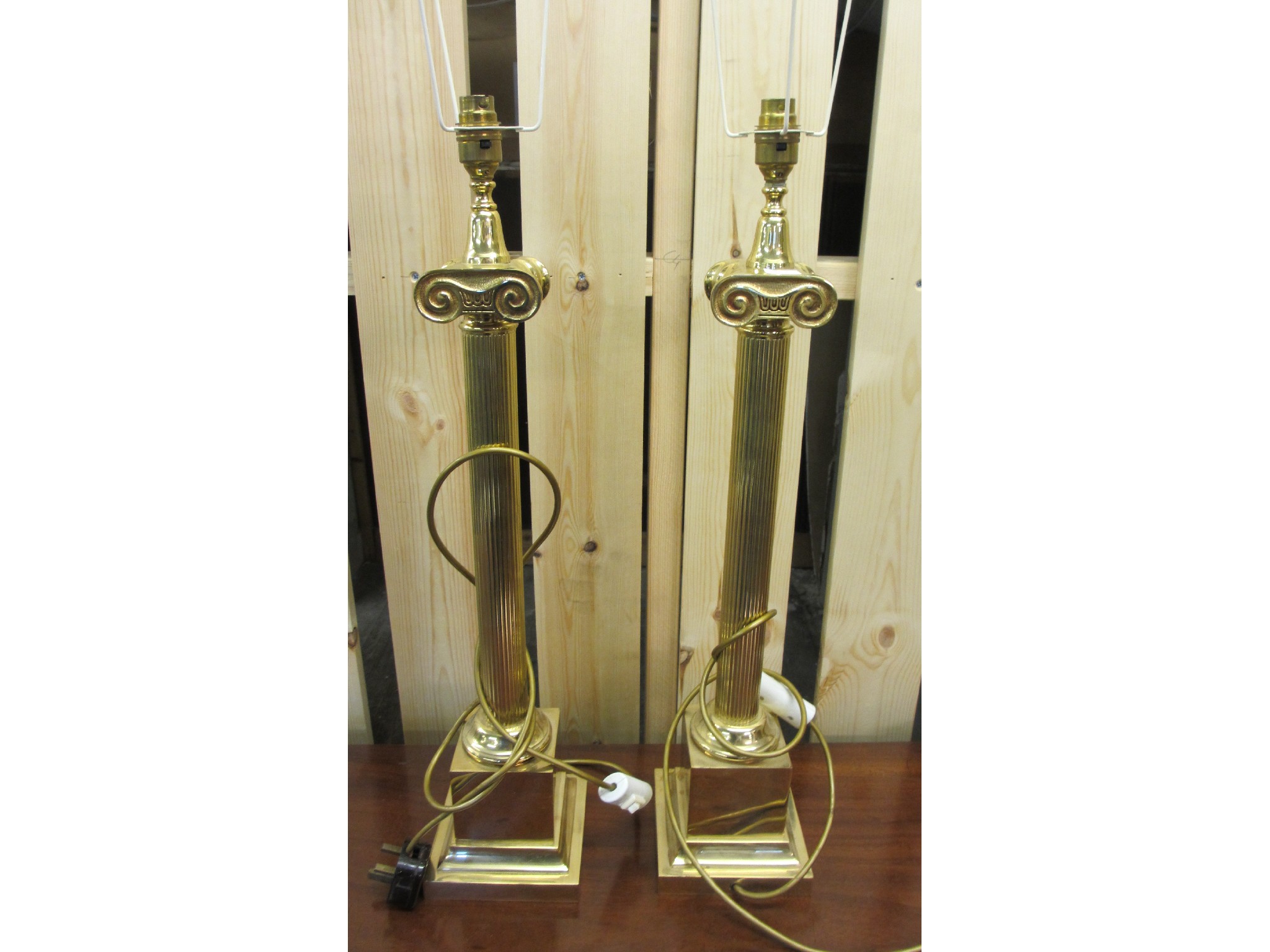 Appraisal: A pair of modern brass table lamps