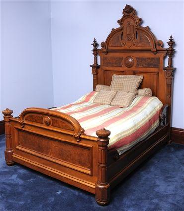 Appraisal: AMERICAN RENAISSANCE REVIVAL INCISED WALNUT AND FIGURED WALNUT BEDSTEAD The