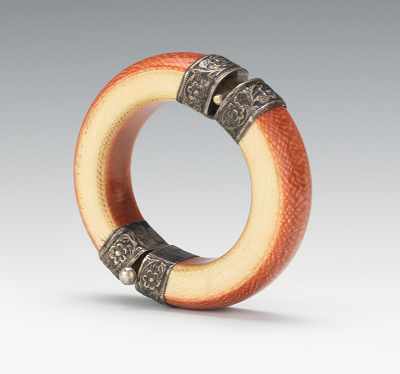 Appraisal: A Carved Ivory and Silver Bangle Bracelet Thick carved ivory