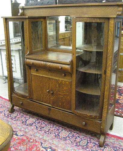 Appraisal: AN OAK CHINA CABINET SIDEBOARD Empire Revival design American c