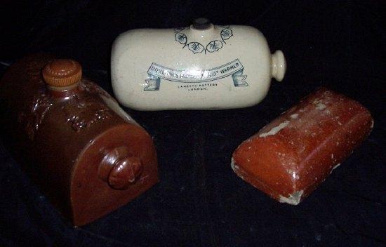 Appraisal: A Doulton's Improved Foot Warmer cm long another stoneware foot