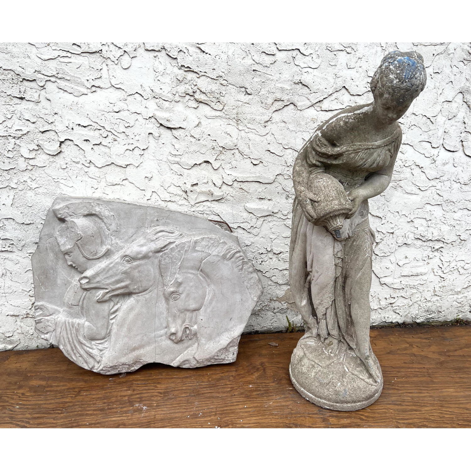 Appraisal: pc Garden Accessories Cast stone statue and Plaster Horse Plaque