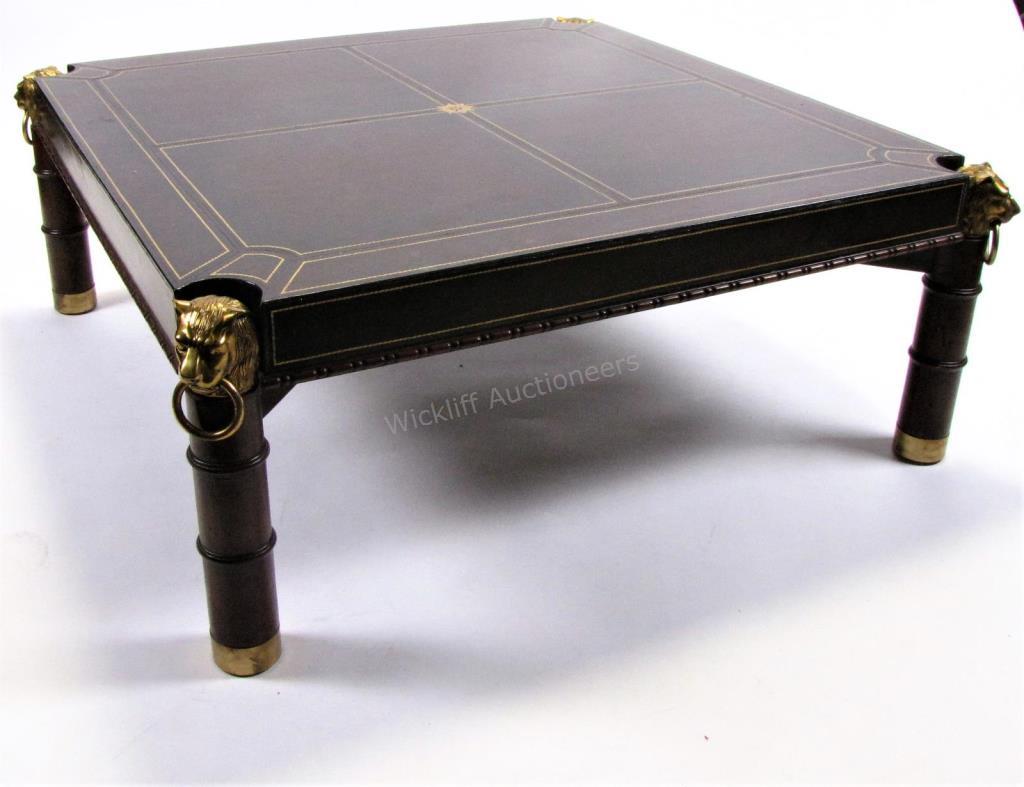 Appraisal: A decorator quality cocktail table with leather sectioned top mounted