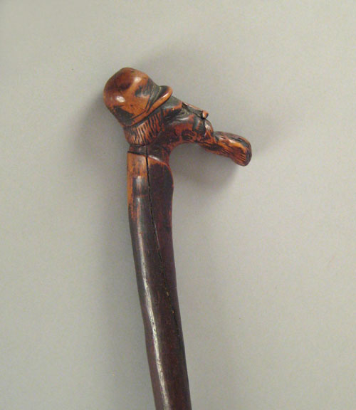 Appraisal: Carved cane th c depicting a gentleman with a long