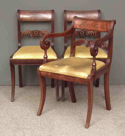 Appraisal: A George III mahogany armchair and two matching single chairs