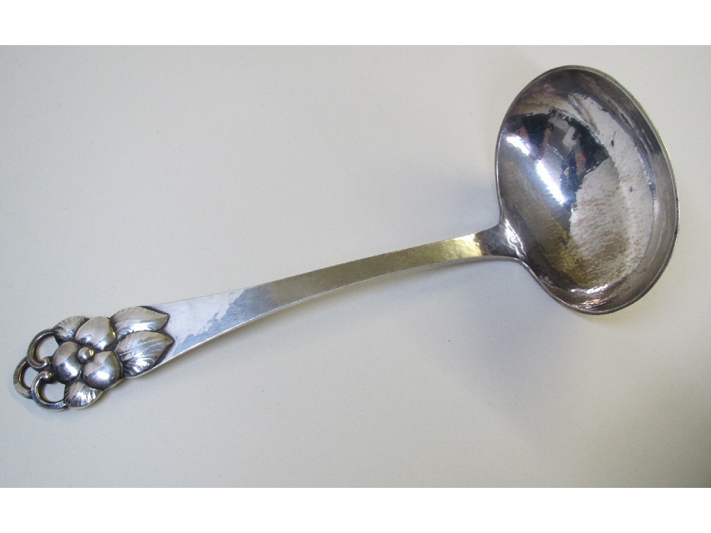 Appraisal: A Danish silver hammered soup ladle with pierced foliate handle