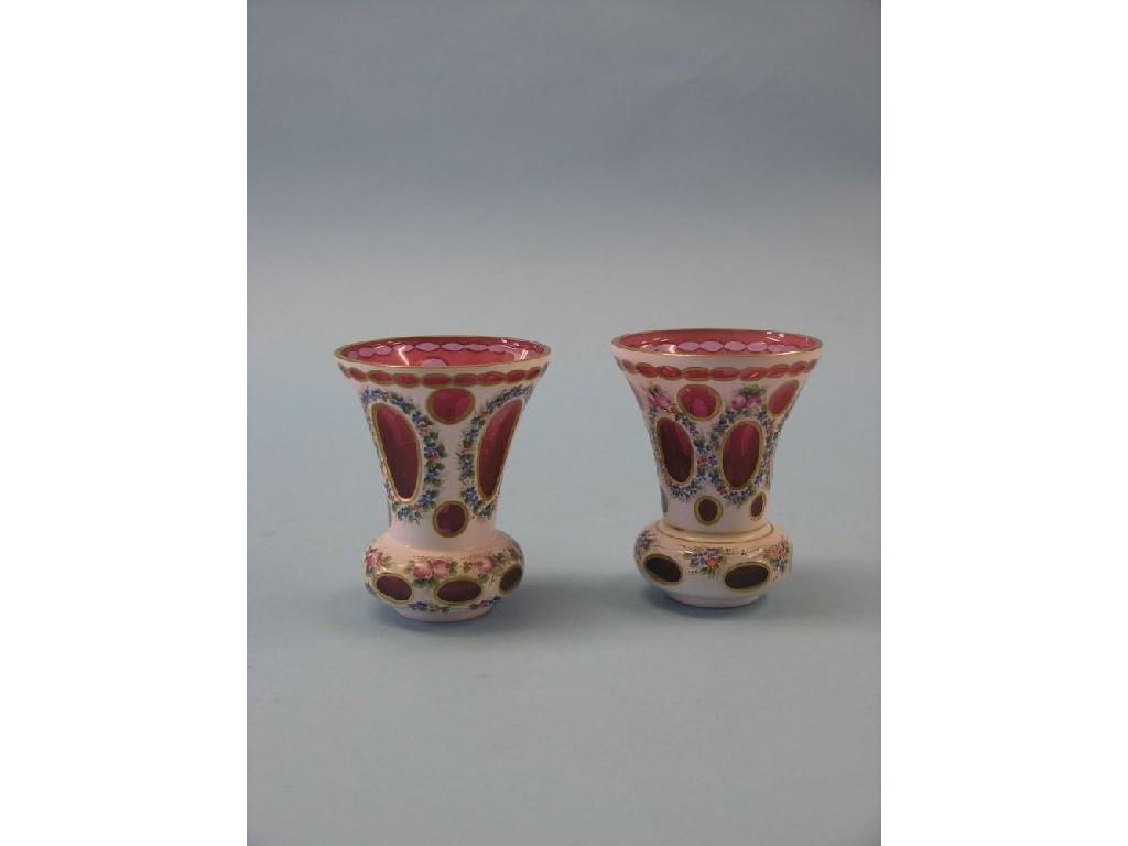 Appraisal: A garniture of three th century Bohemian overlaid glass vases