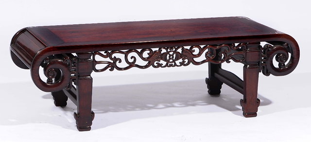 Appraisal: A Chinese hardwood low table th Centurywith scroll frieze cm