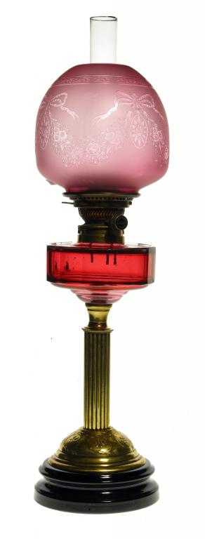 Appraisal: A VICTORIAN BRASS OIL LAMP with cranberry faceted fount and