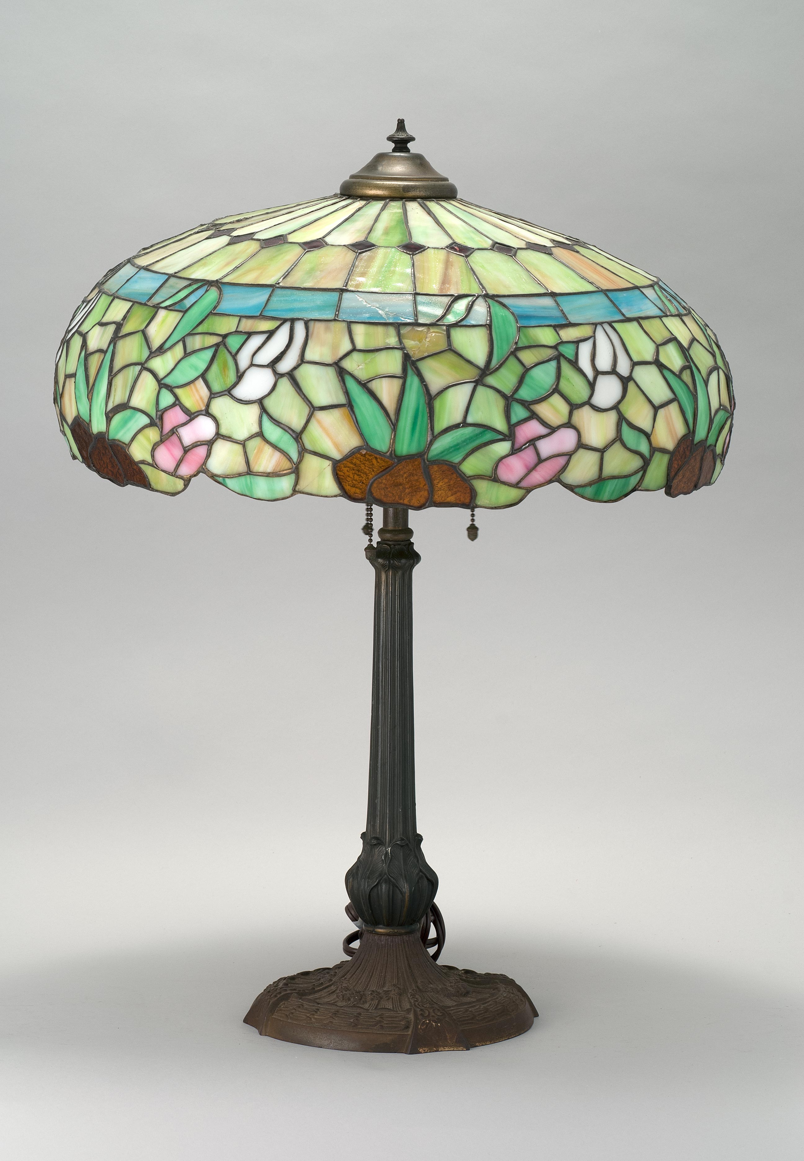 Appraisal: ART NOUVEAU MIXED-METAL TABLE LAMP WITH LEADED GLASS SHADE Base