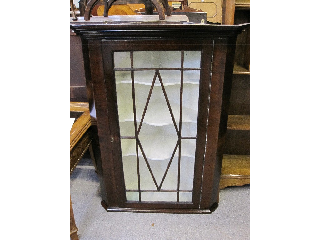 Appraisal: Astragal glazed mahogany wall cabinet