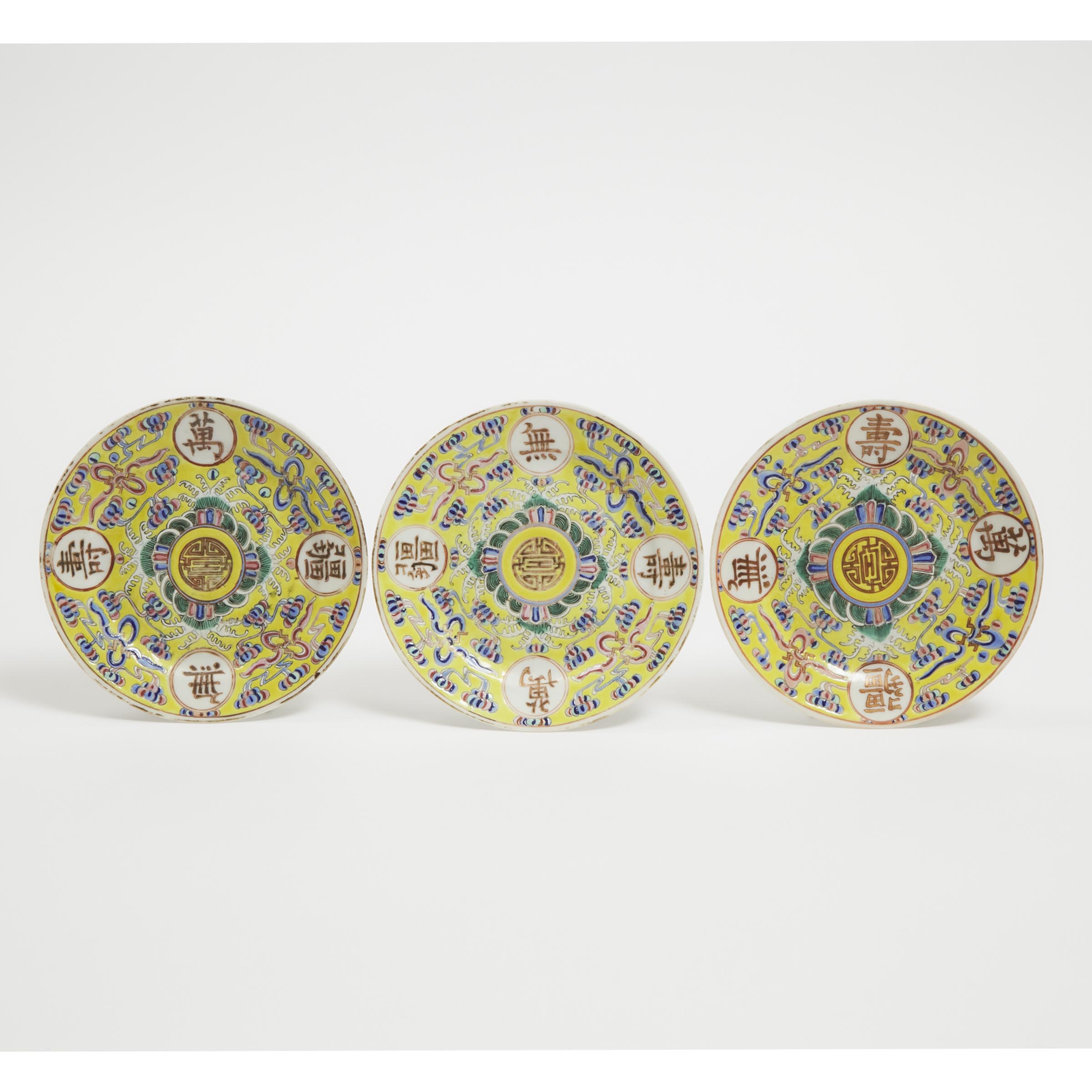 Appraisal: Three Famille Rose and Gilt-Decorated Yellow-Ground 'Longevity' Plates Guangxu Mark