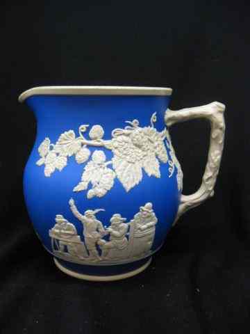 Appraisal: Copeland Spode Jasperware Pitcher festive scenes ivory on blue ''