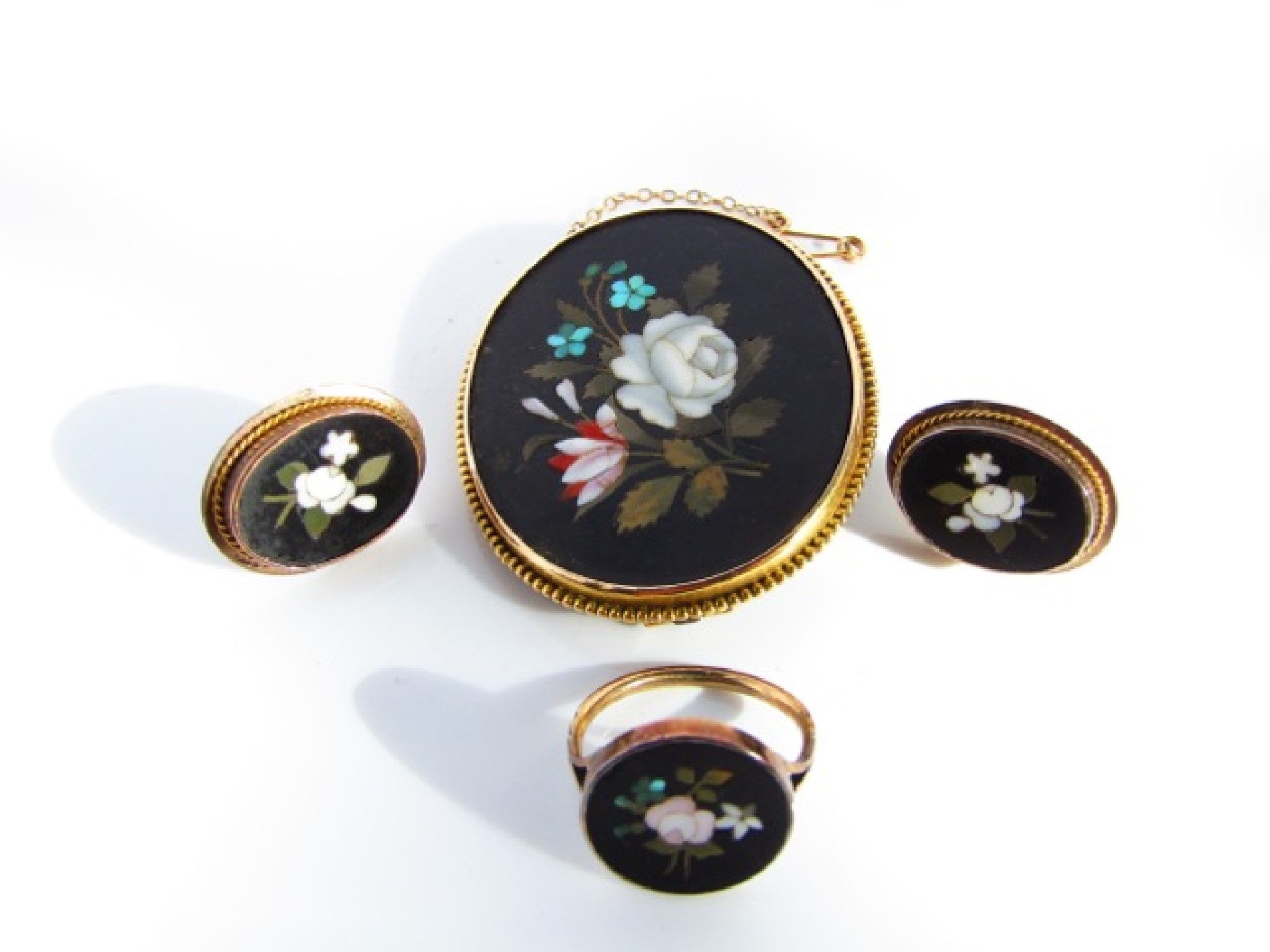 Appraisal: A pietra dura inlaid associated set comprising a brooch a