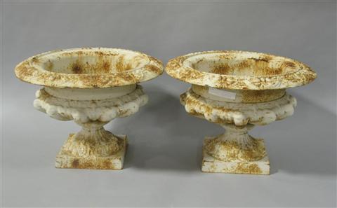 Appraisal: PAIR OF CAST IRON GARDEN URNS h w in