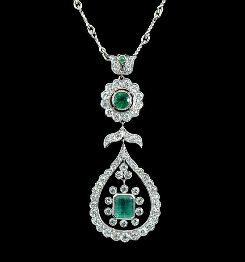 Appraisal: CUSTOM PLATINUM EMERALD AND DIAMOND NECKLACE part reticulated pendant At