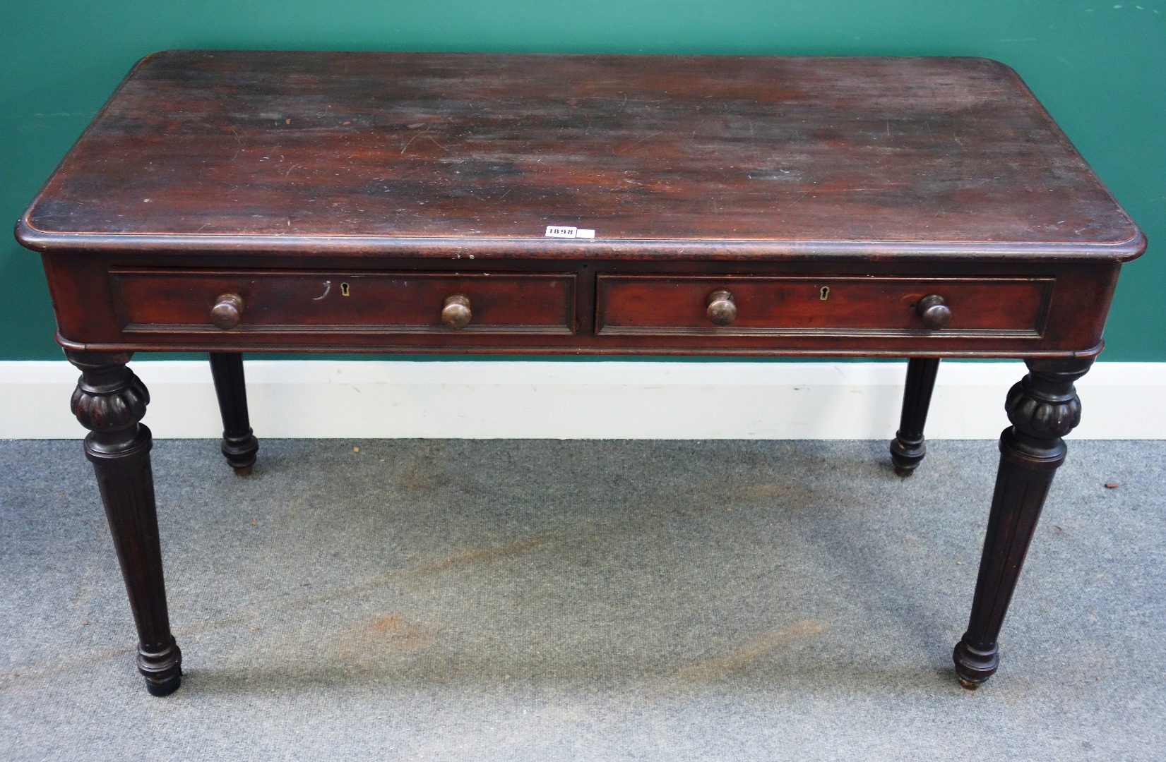 Appraisal: An early Victorian mahogany centre writing table with pair of