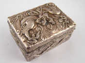 Appraisal: A Chinese silver cased hardwood box finely embossed in high