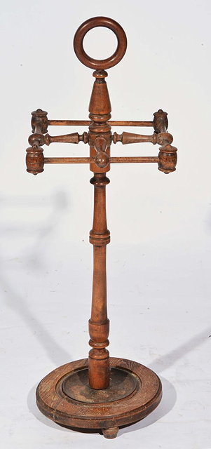 Appraisal: A VICTORIAN BEECHWOOD AND OAK STICK STAND on circular base