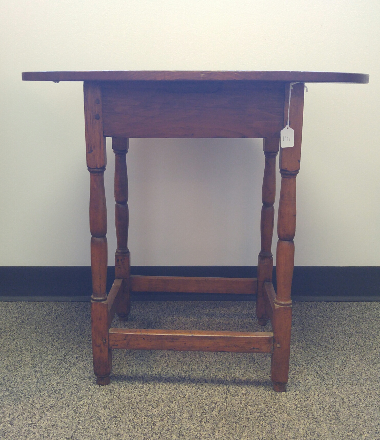 Appraisal: OVAL TOP TAVERN TABLE American pine Stretcher base with pegged