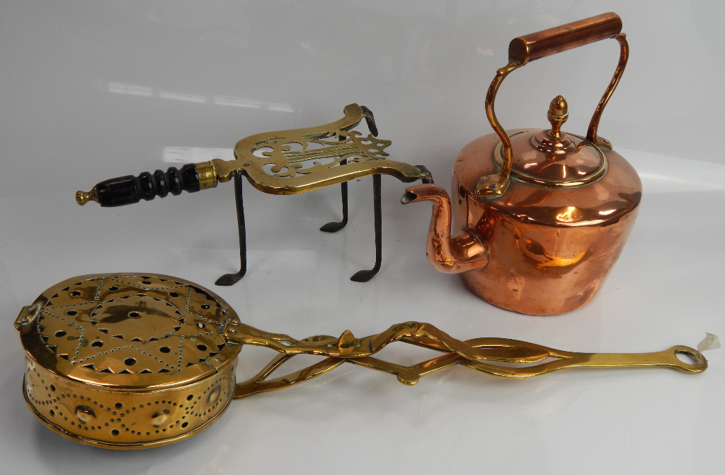 Appraisal: A brass chestnut roaster with hinged lock down lid and