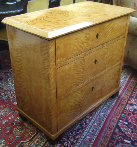 Appraisal: A th century Biedermeier satin birch chest of three long