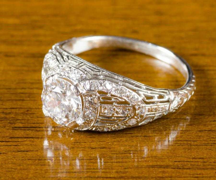 Appraisal: ESTATE DIAMOND AND PLATINUM FILIGREE RING with appraisal The platinum