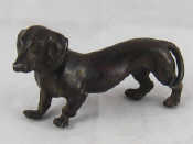 Appraisal: A well modelled bronze dachshund one leg AF length cm