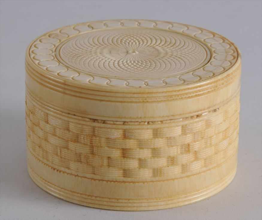 Appraisal: RUSSIAN CARVED IVORY SEWING BOX The screw-on lid with overlapping