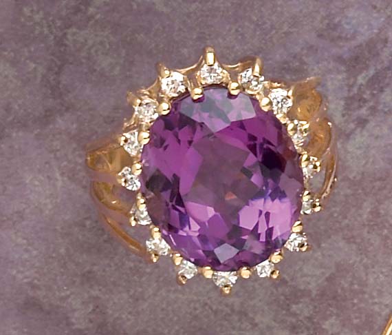 Appraisal: AMETHYST AND DIAMOND RING Yellow gold ring set with one