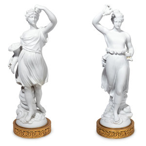 Appraisal: A Pair of Gilt Metal Mounted Bisque Porcelain Figures th