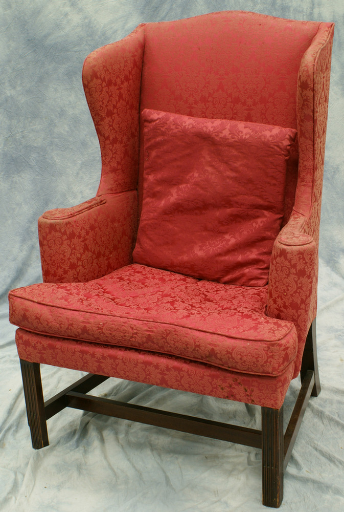 Appraisal: Red damask upholstered wing chair with reeded legs condition issues