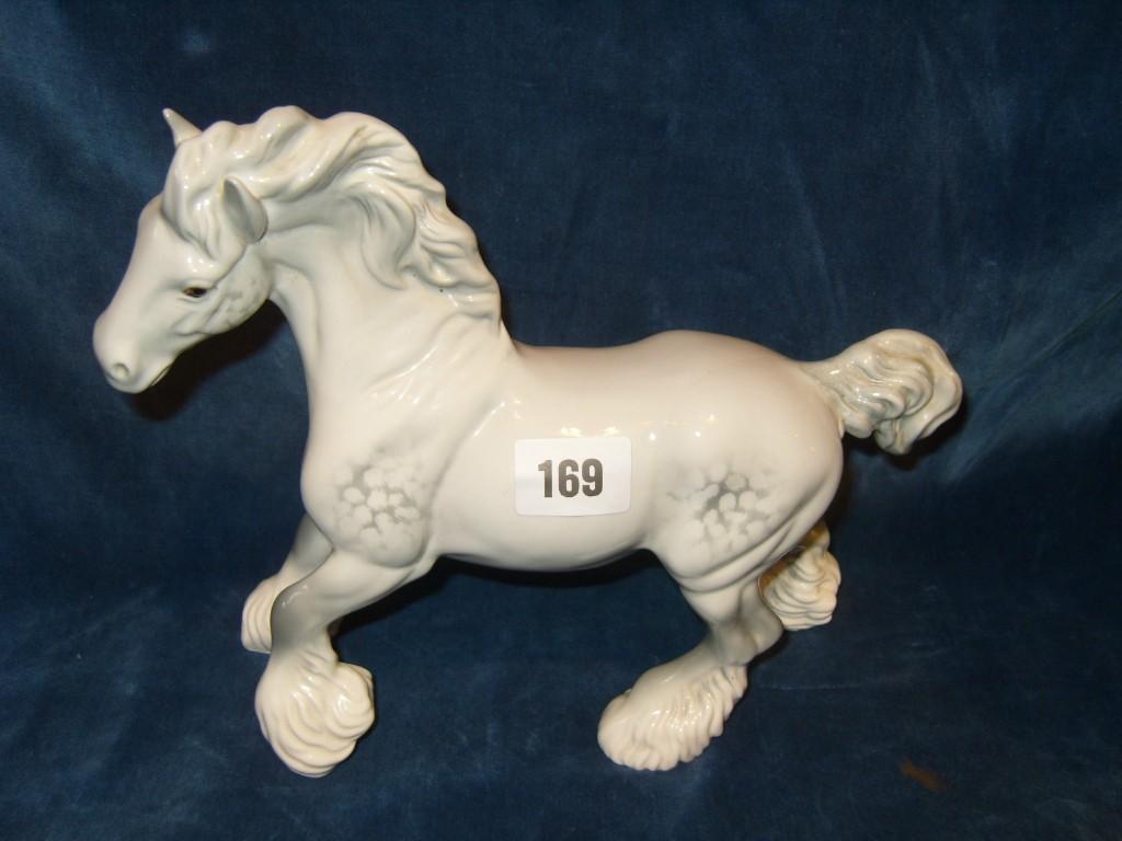 Appraisal: A Beswick model of a trotting white shire horse with